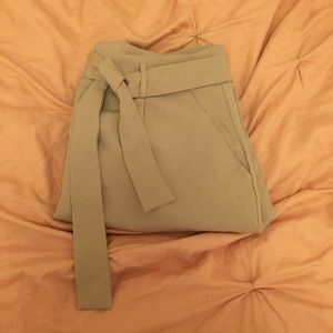 Beige tie-waist slacks